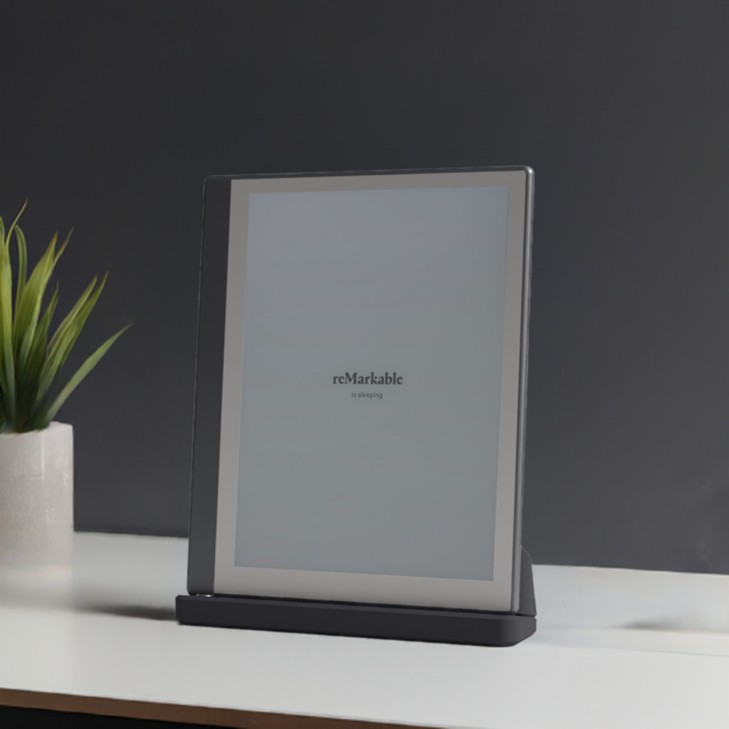 Remarkable Dock charging dock holding a reMarkable 2 tablet upright on a desk